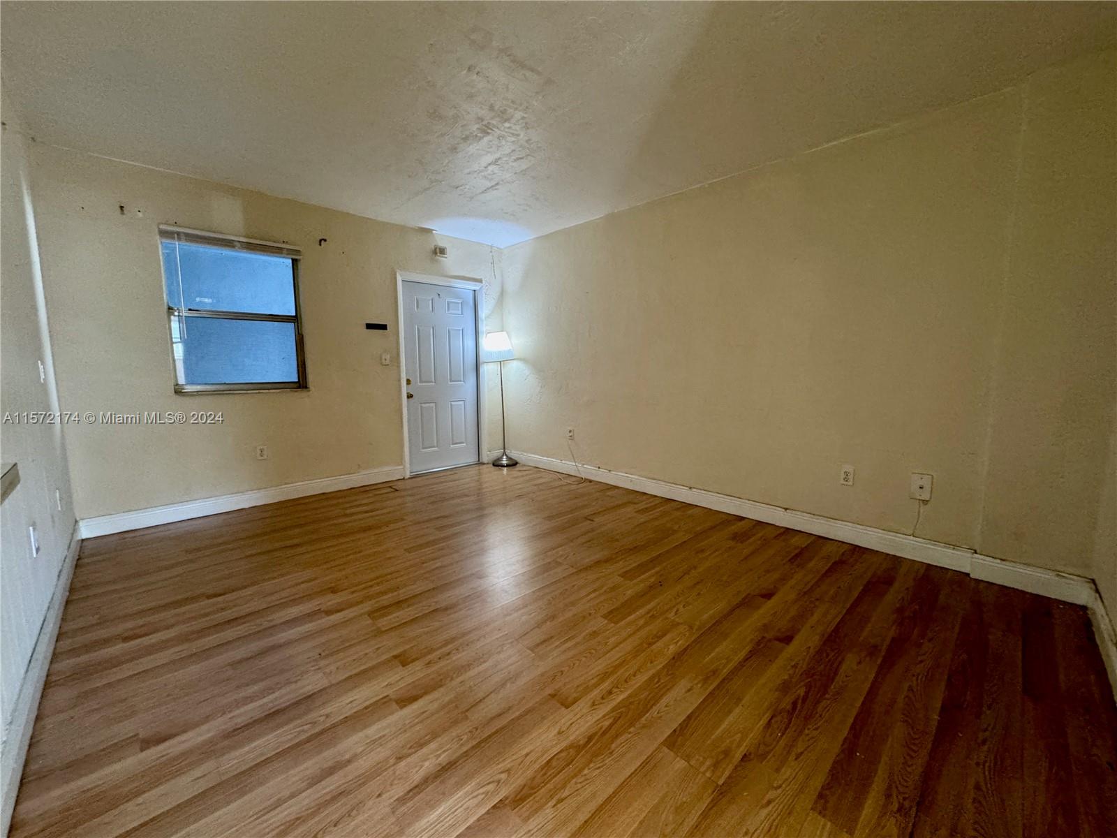 4250 Southwest 67th Avenue, Unit 6 Miami, FL 33155 - Photo 3 of 18 a view of a room with wooden floor
