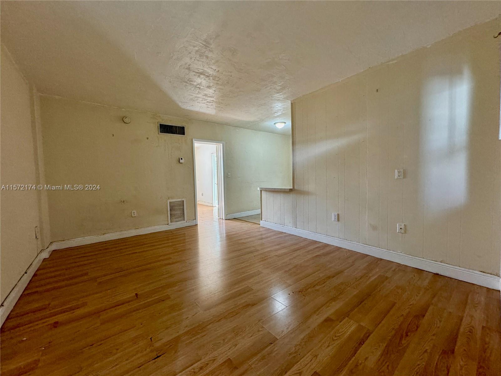 4250 Southwest 67th Avenue, Unit 6 Miami, FL 33155 - Photo 4 of 18 a view of a room with wooden floor