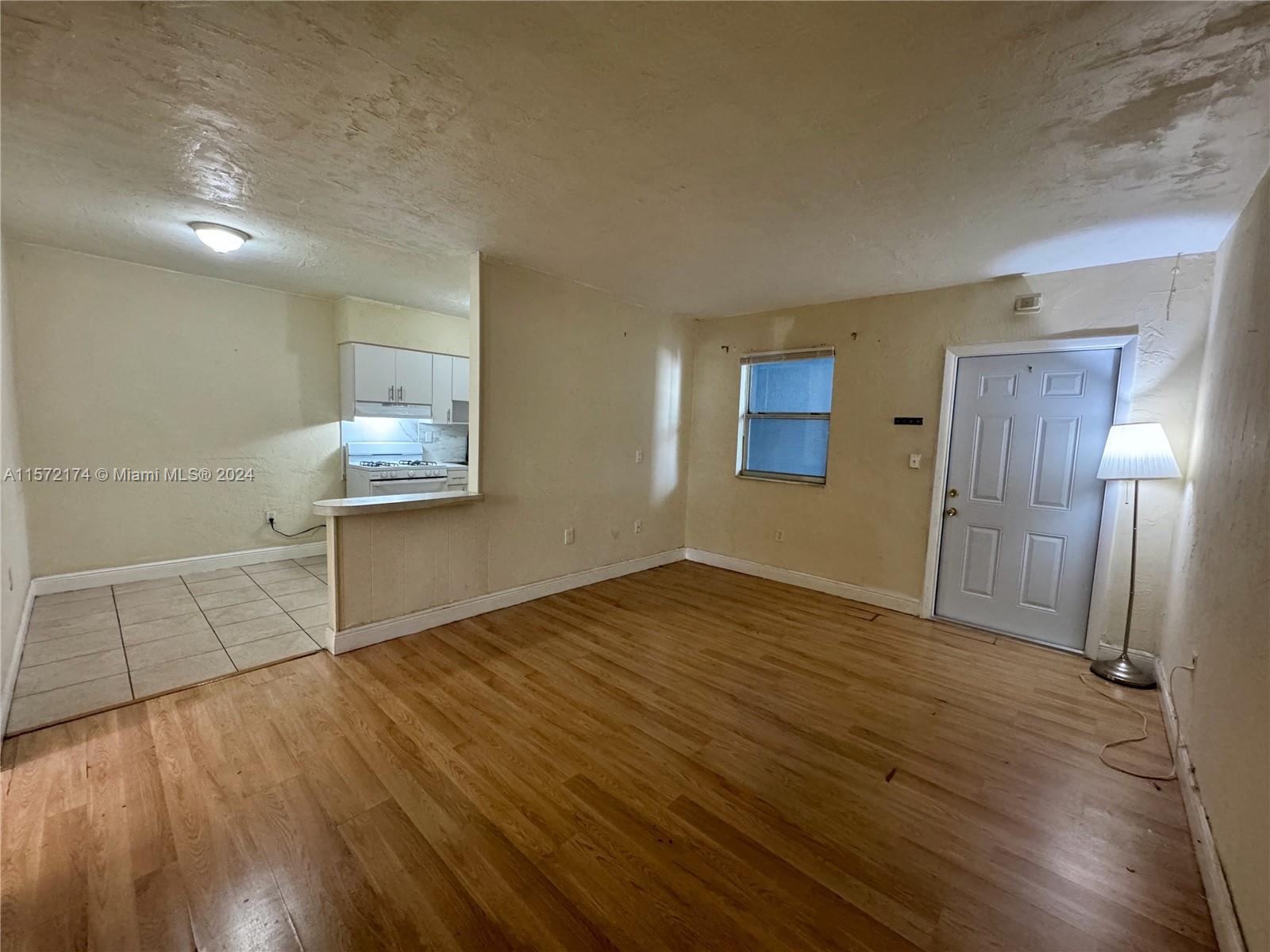 4250 Southwest 67th Avenue, Unit 6 Miami, FL 33155 - Photo 5 of 18 a view of empty room with wooden floor