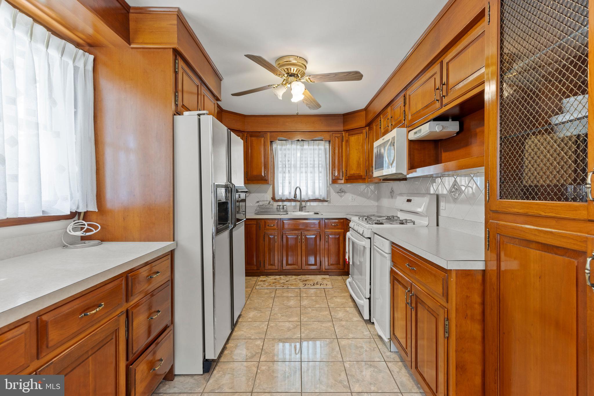1008 Rosedale Avenue Baltimore, MD 21237 - Photo 8 of 45 a kitchen with stainless steel appliances granite countertop a sink and cabinets