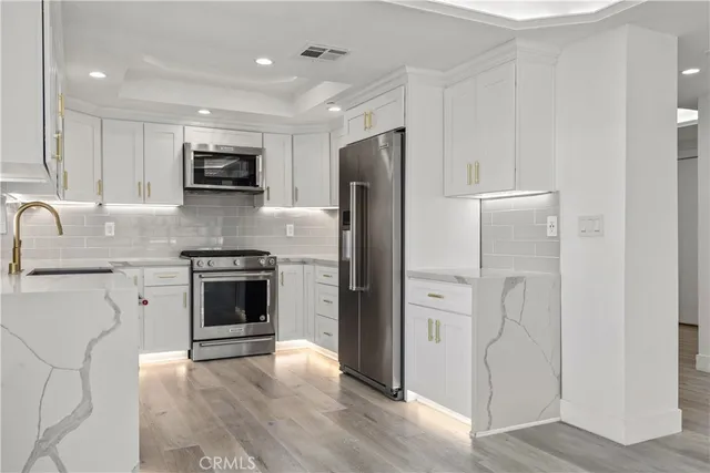 a view of balcony with wooden floor and outdoor seating