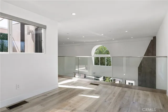 a wooden bench sitting in the middle of a building