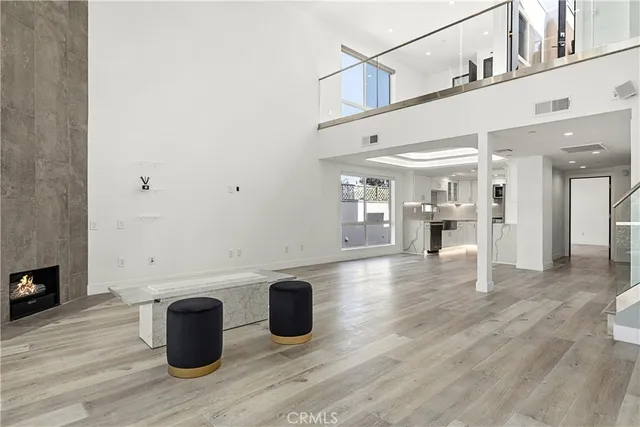 a view of a living room and hardwood floor