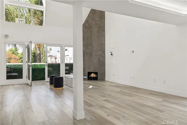 a view of a kitchen with wooden floor and staircase