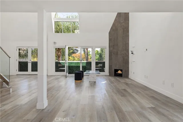 a view of kitchen with refrigerator microwave and cabinets