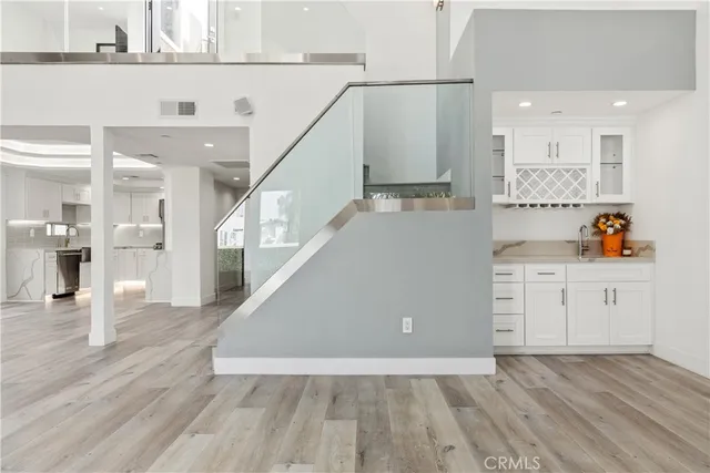 a kitchen with stainless steel appliances a refrigerator sink and microwave