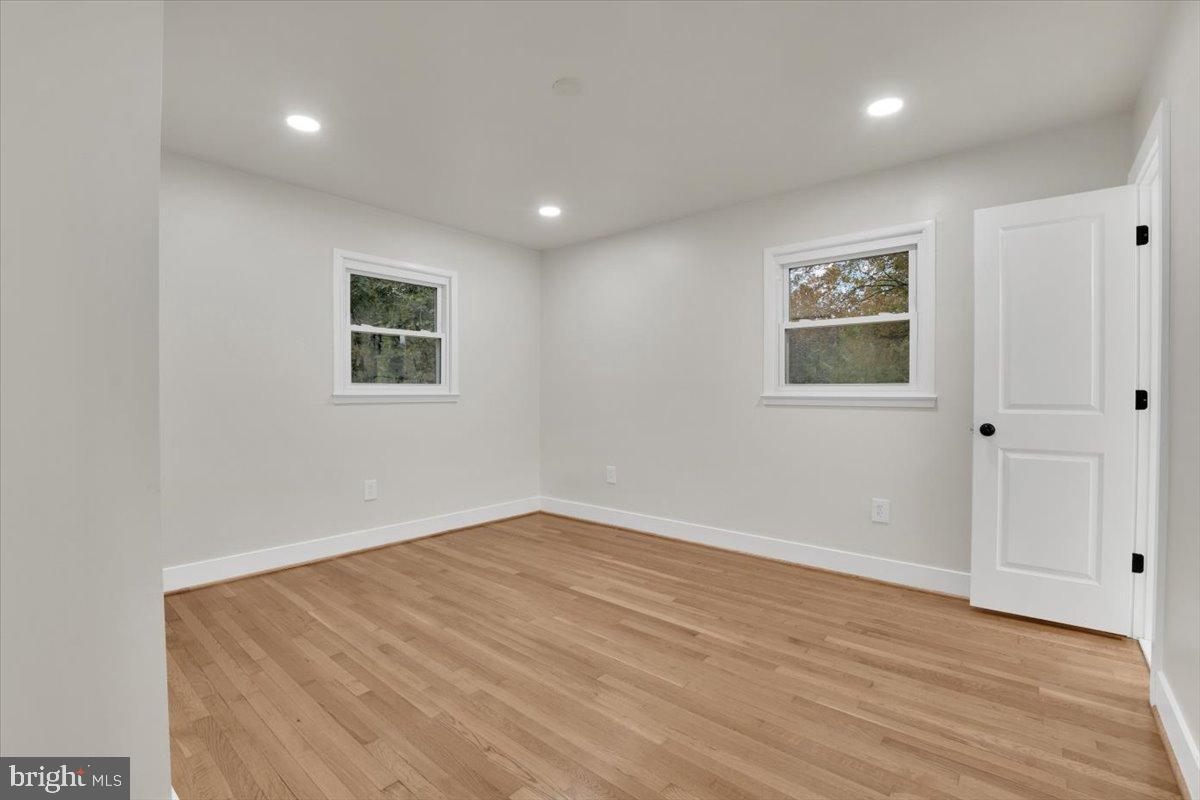 14624 Danville Road Woodbridge, VA 22193 - Photo 24 of 32 a view of empty room with wooden floor and fan