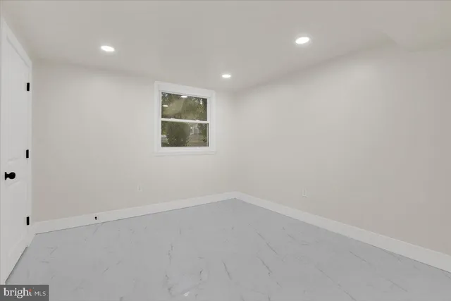 an empty room with a empty space and window