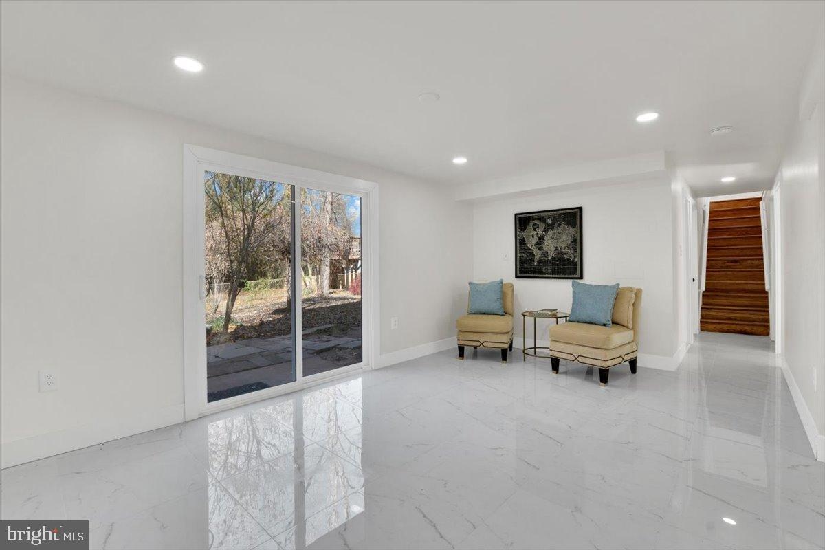 14624 Danville Road Woodbridge, VA 22193 - Photo 29 of 32 a living room with furniture and a floor to ceiling window