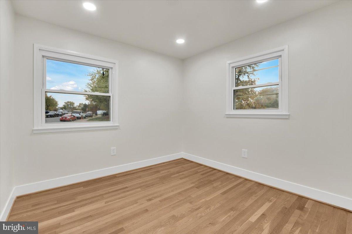 14624 Danville Road Woodbridge, VA 22193 - Photo 6 of 32 a view of room with window and wooden floor