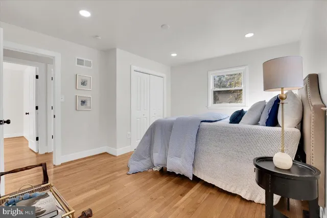 a bedroom with a bed and a chair