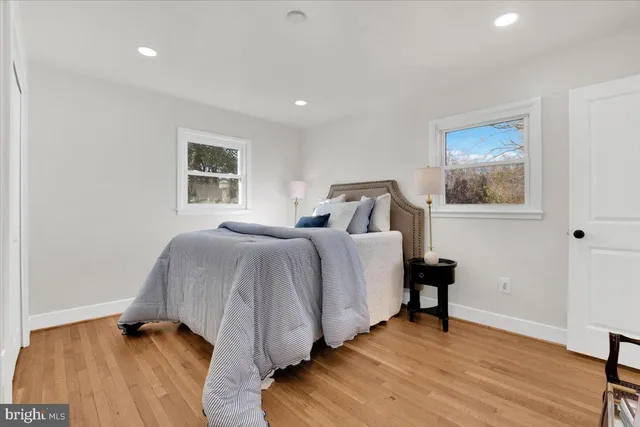 a bedroom with a bed and a table