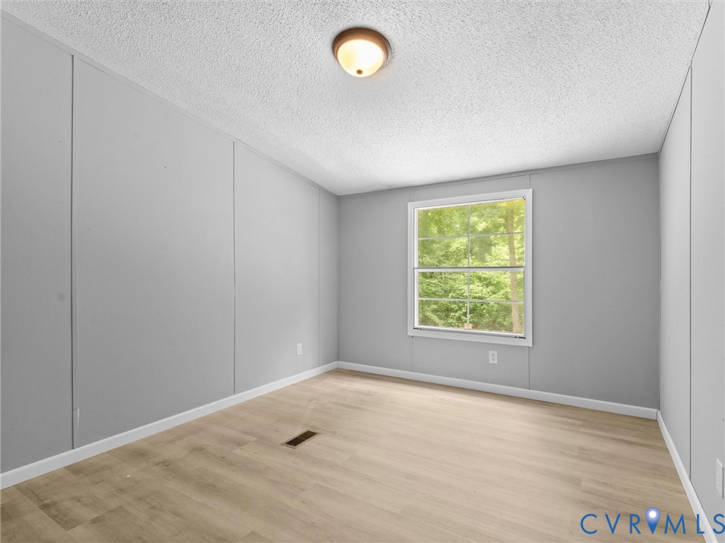 1909 Neves Road Beaverdam, VA 23015 - Photo 35 of 48 Wood-finish flooring, single window with white tri