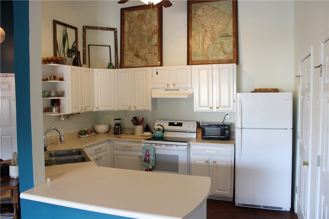 151 Wexford Drive, Unit 302 Anderson, SC 29621 - Photo 7 of 17 This functional kitchen provides a practical and inviting atmosphere for daily living.