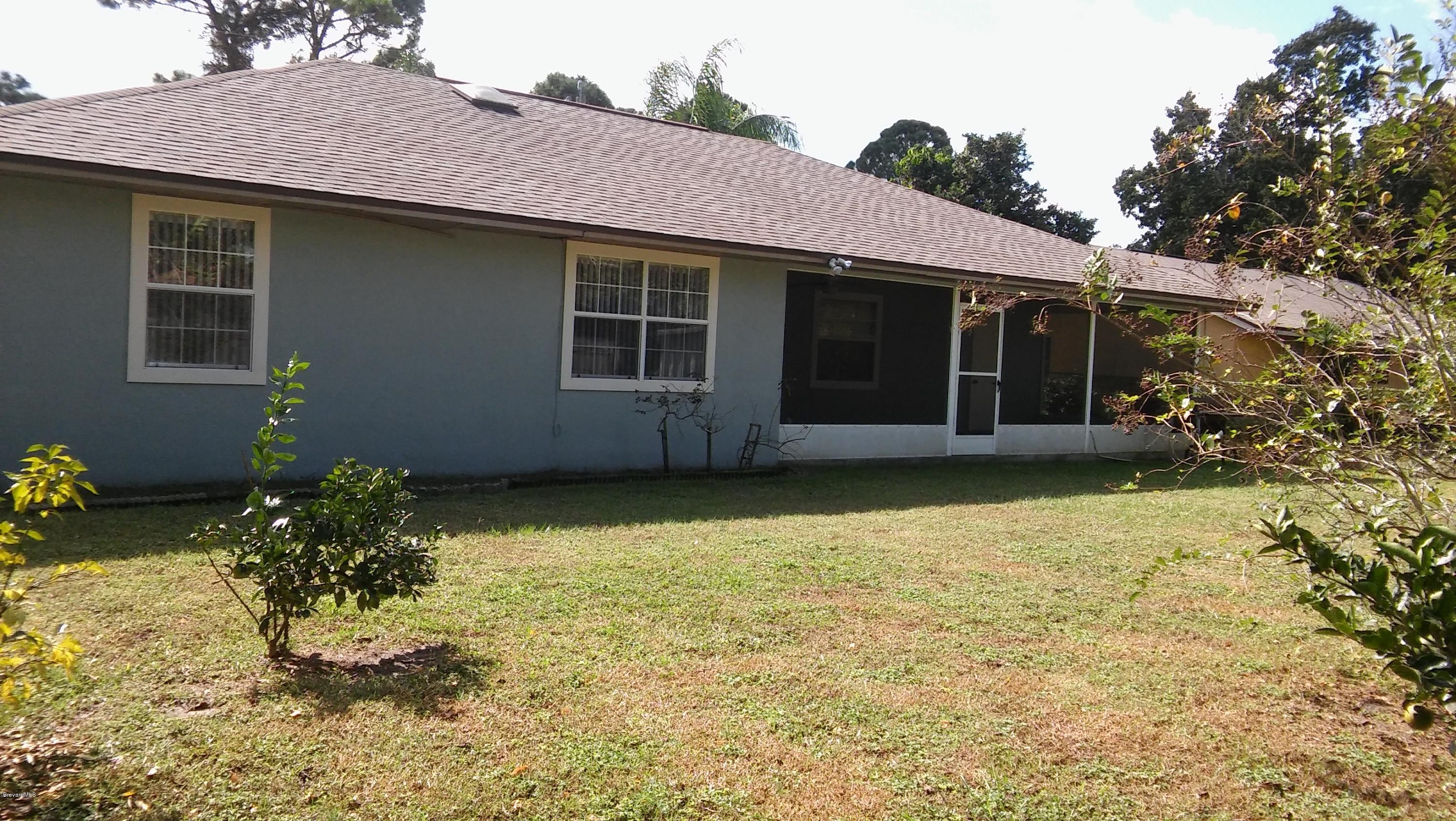 4120 Delespine Road Cocoa, FL 32927 - Photo 14 of 15 Back of Home and Sreened Porch