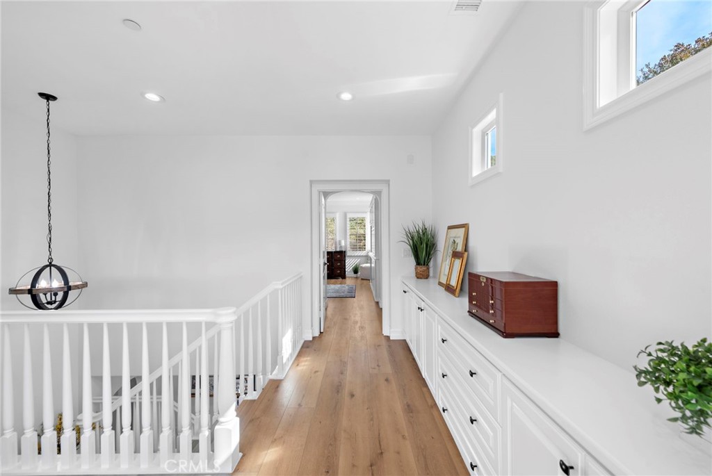 14 Via Inca San Clemente, CA 92673 - Photo 15 of 29 a hallway with white couches with wooden floor