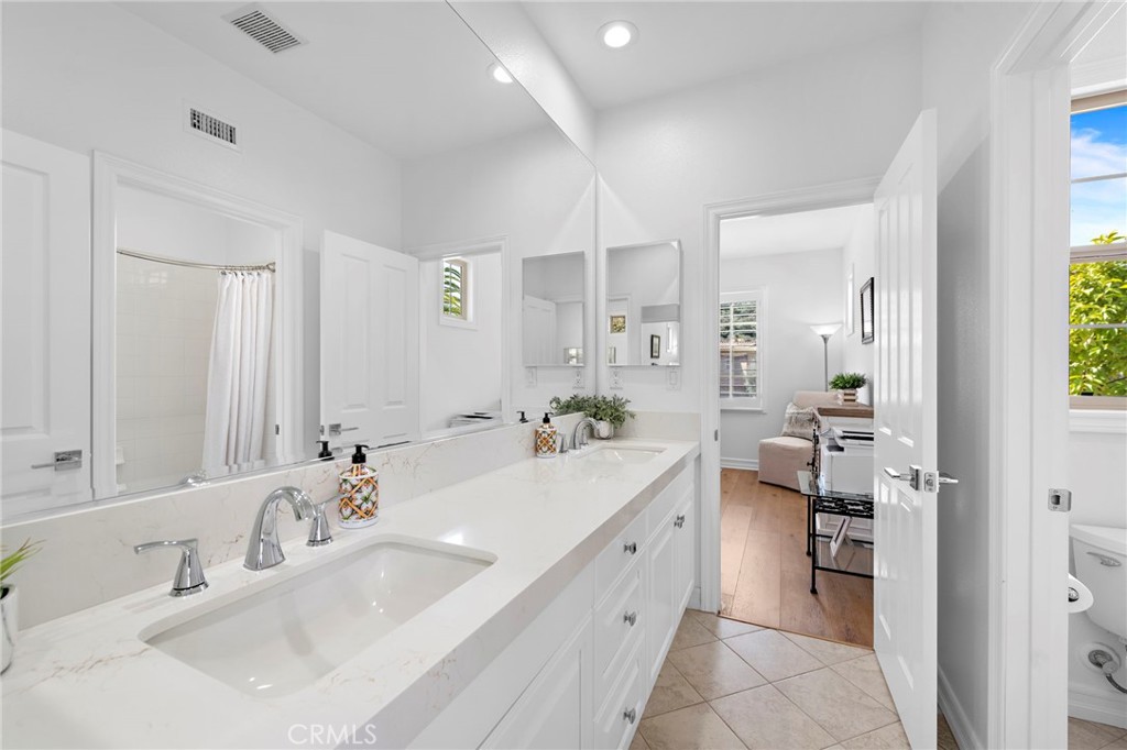 14 Via Inca San Clemente, CA 92673 - Photo 21 of 29 a spacious bathroom with a double vanity sink and a mirror