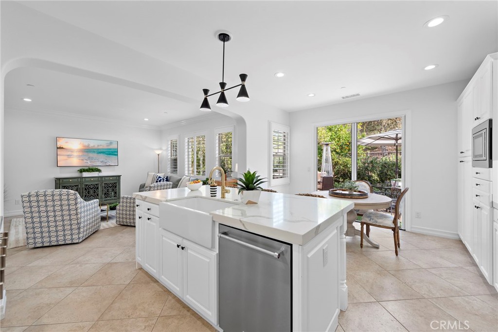 14 Via Inca San Clemente, CA 92673 - Photo 6 of 29 a kitchen with a sink stove and cabinets