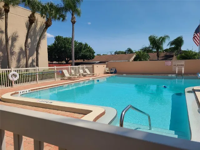 a view of an outdoor sitting area with furniture