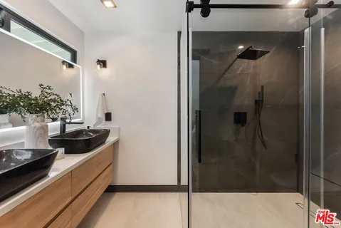 a bathroom with a tub and shower