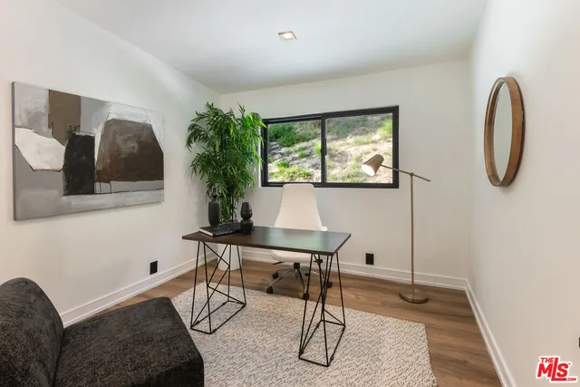 a workspace with furniture and window