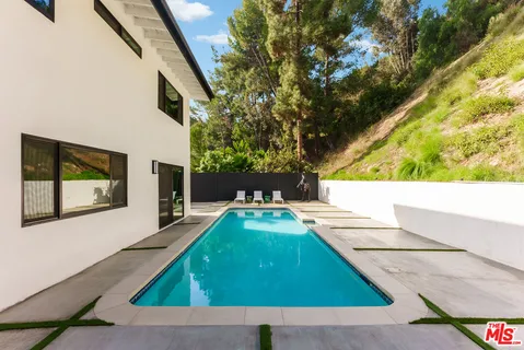 a view of a backyard with a small cabin