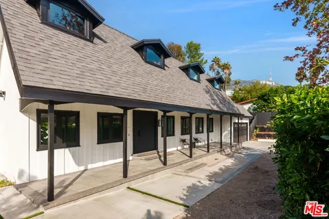 a front view of a house with a porch