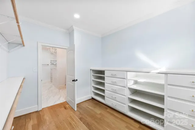 an empty room with a ceiling fan and a window