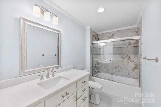 an empty room with windows and chandelier fan