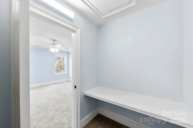 a view of an entryway with a chandelier