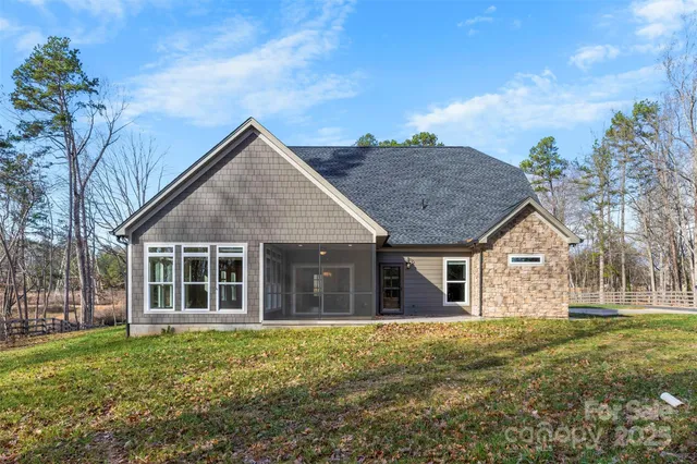 a view of a house with a backyard