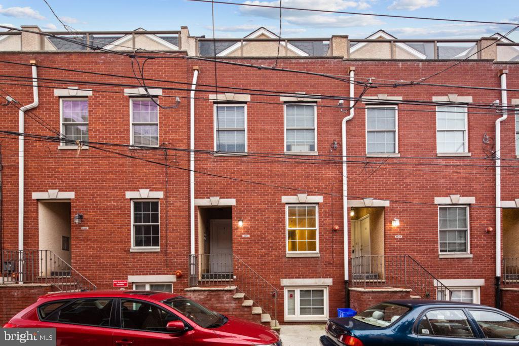 2614 Webster Street, Unit A Philadelphia, PA 19146 - Photo 12 of 12 a couple of cars parked in front of a building
