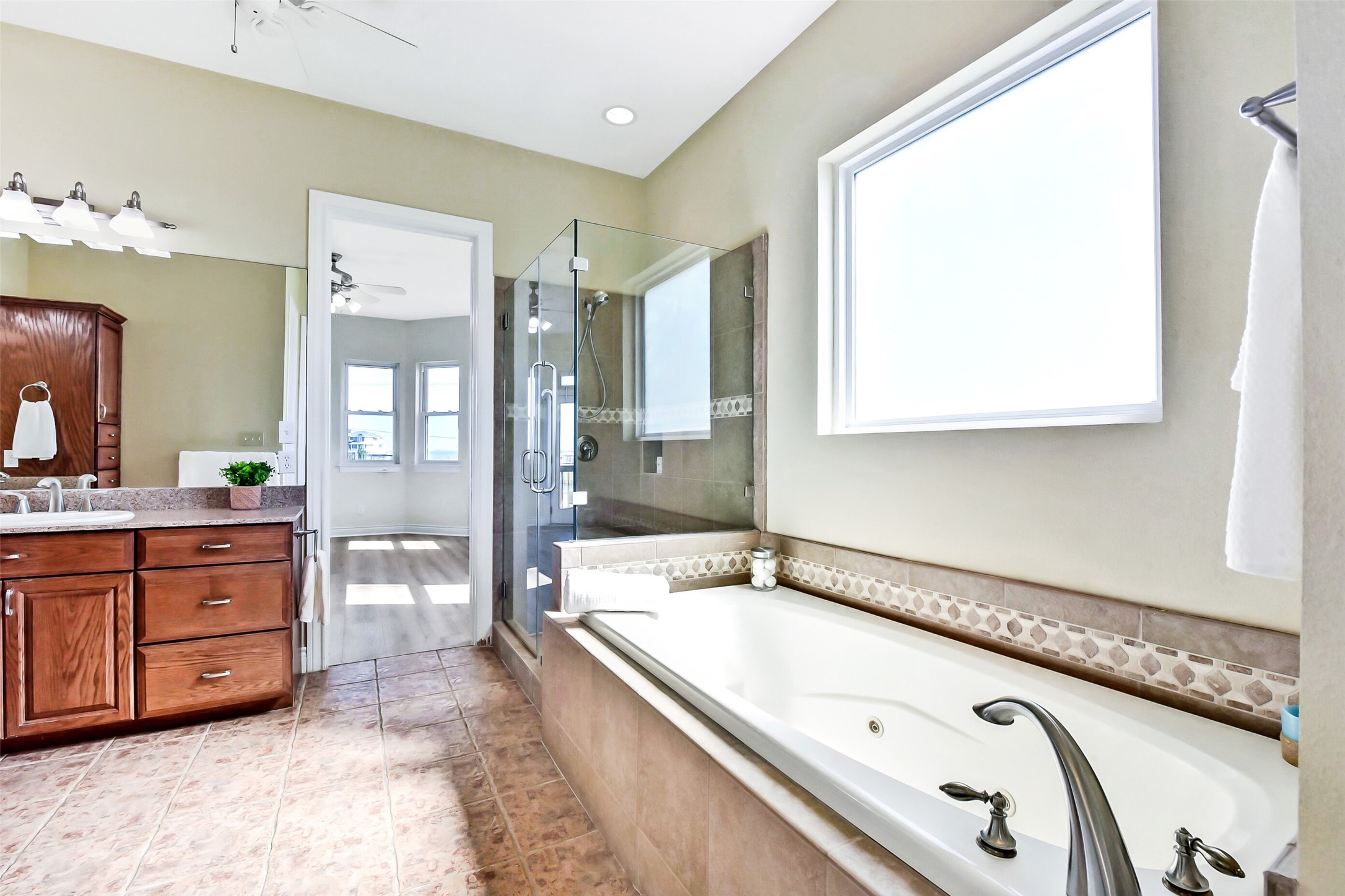 1 Loggerhead Hitchcock, TX 77563 - Photo 22 of 50 a spacious bathroom with a granite countertop sink mirror and bathtub