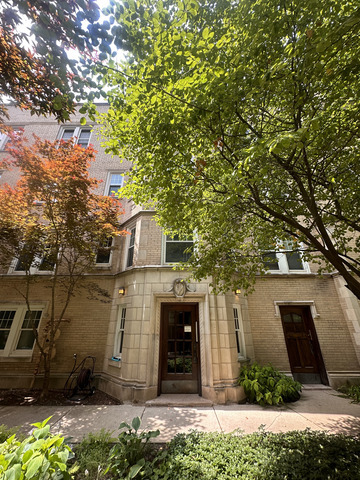 1459 West Elmdale Avenue, Unit 3 Chicago, IL 60660 - Photo 1 of 13 a front view of a house with a garden