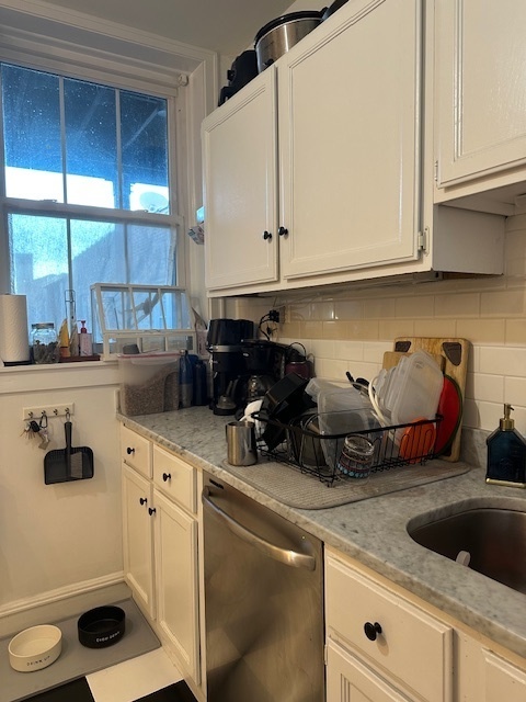 1459 West Elmdale Avenue, Unit 3 Chicago, IL 60660 - Photo 13 of 13 a kitchen with a sink and cabinets