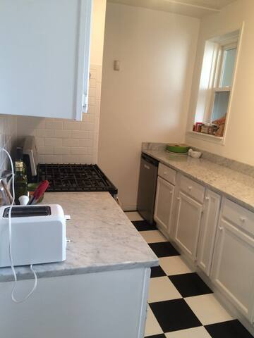 1459 West Elmdale Avenue, Unit 3 Chicago, IL 60660 - Photo 7 of 13 a kitchen with a sink and a stove top oven