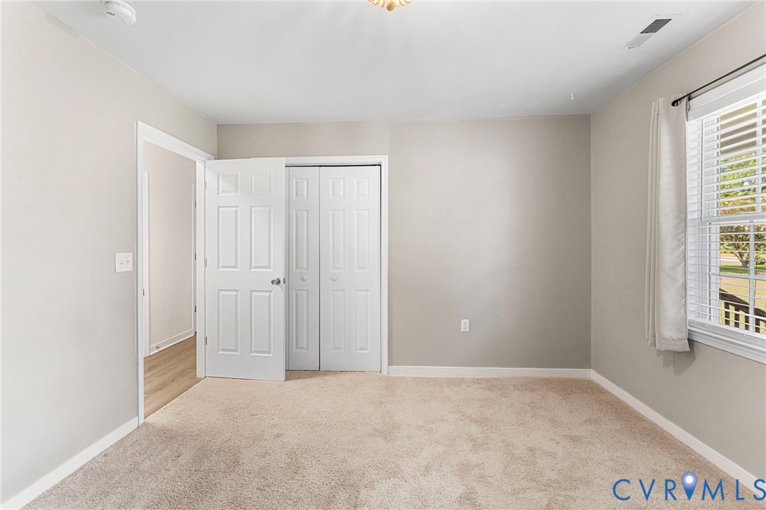 1146 Indian Valley Road Heathsville, VA 22473 - Photo 24 of 45 an empty room with windows and entrance