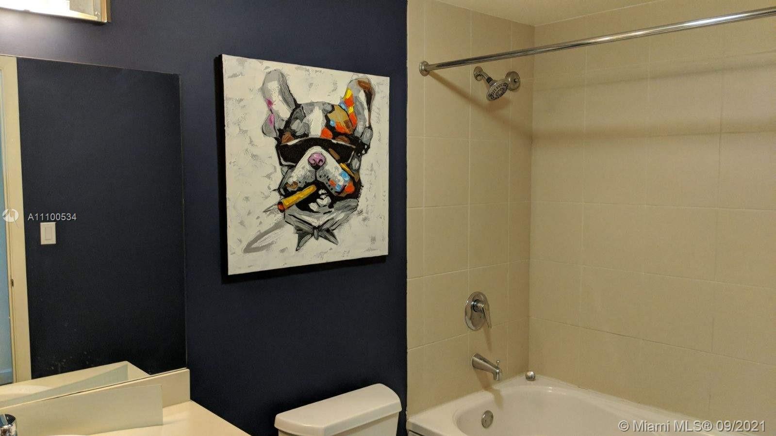 2889 McFarlane Road, Unit 1603 Miami, FL 33133 - Photo 11 of 16 a bathroom with a toilet and a shower