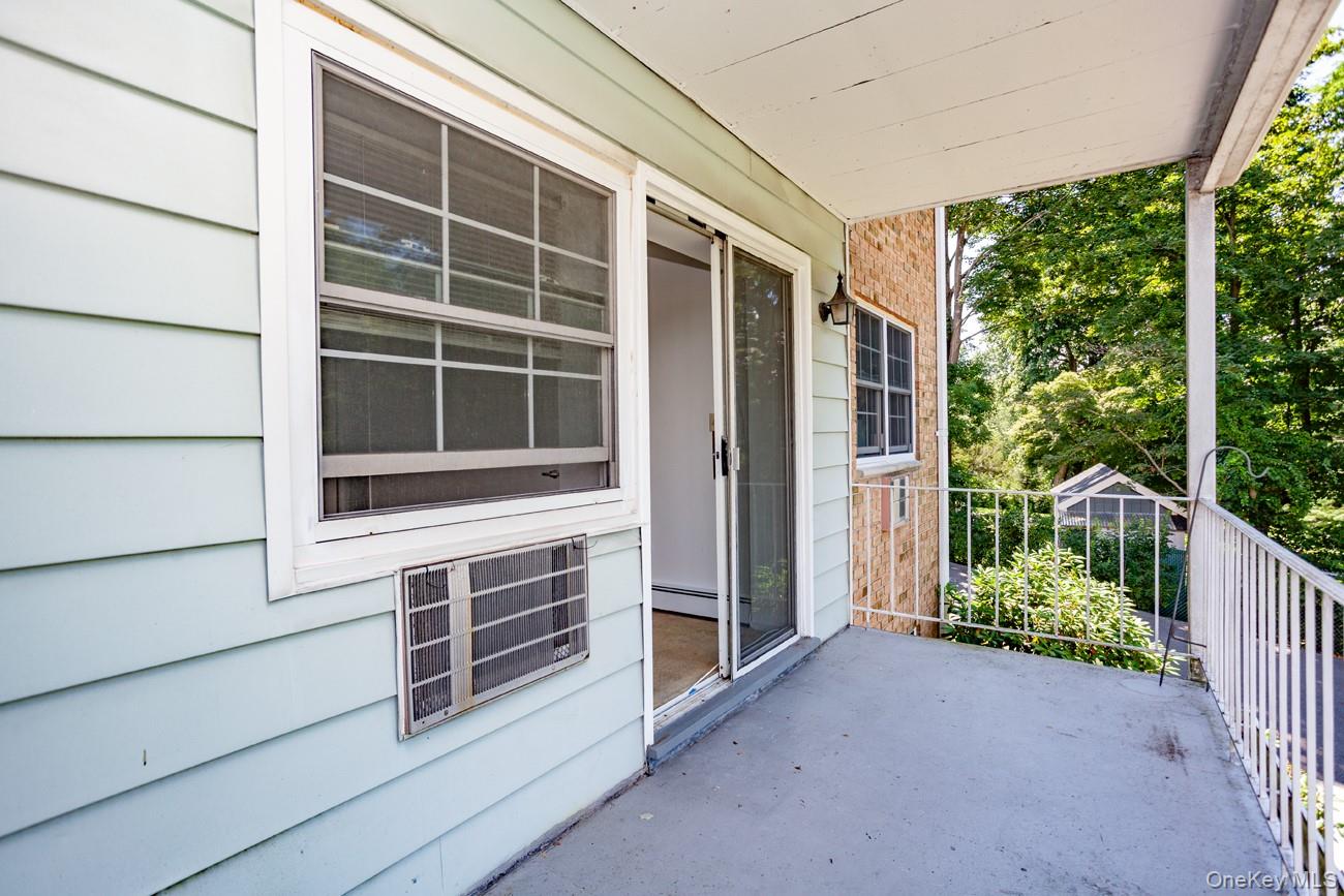 1840 Crompond Road, Unit 7B8 Peekskill, NY 10566 - Photo 15 of 22 a view of front door and yard from balcony