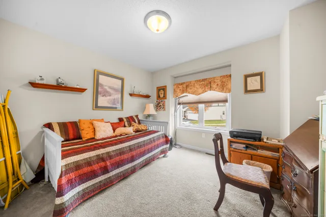 a room with a bed and furniture