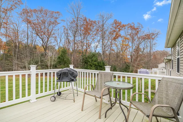 a view of a garage with a white house