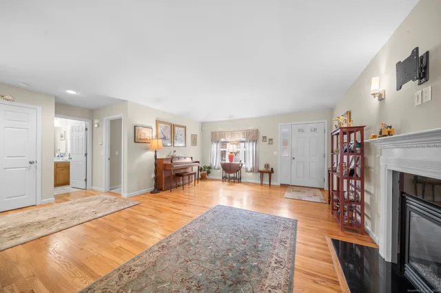 a view of a livingroom with furniture and a fireplace