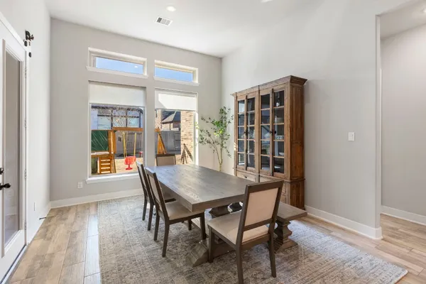 a bathroom with a toilet a sink and a window