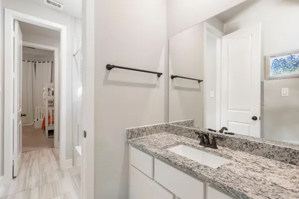 a room with a book shelf and a couch