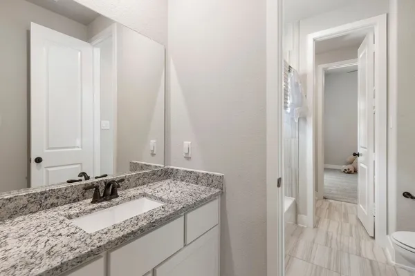 a view of a brick house with a large window