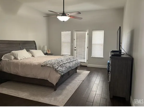 a bedroom with double bed and window