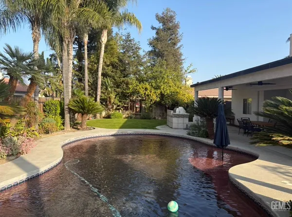a view of a swimming pool with a patio