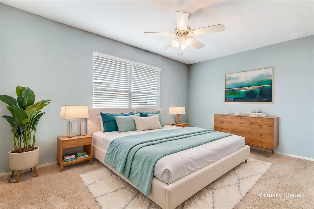 1445 Berkley Road Allen, TX 75002 - Photo 20 of 30 This spacious secondary bedroom has a calming color scheme, ceiling fan, and plenty of closet space.
