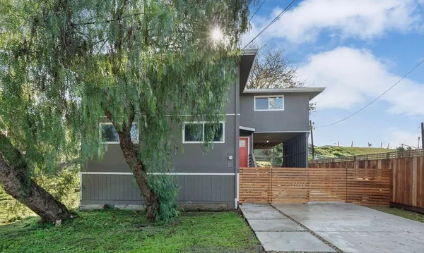 a view of house with yard