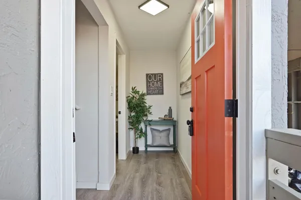 a view of a hallway and interior of a house